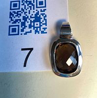 front view showing smoky quartz in silver bezel