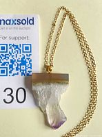 Front view of amethyst slice pendant on gold-tone chain