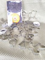 Group of 30 loose metal cookie cutters plus boxed gingerbread girl
