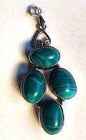 Front view showing four oval malachite stones and bail