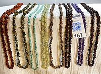 All eight gemstone chip strands hanging to show full lot and color variety