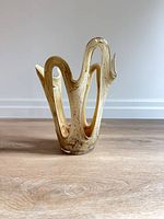 Front view of sculptural beige and brown marbled vase