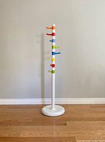 Full view of coat rack standing on floor