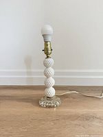 Full view of lamp without shade showing stacked hobnail milk glass and clear glass base