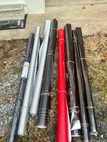 Group of vinyl wrap rolls in black, silver, red