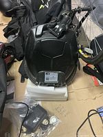 Front view of black Kingsong KS18L electric unicycle standing on foam block