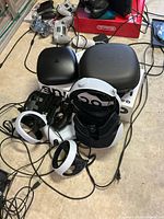PlayStation VR2 headset, Sense controllers, hard cases, assorted cables