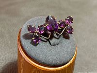 Front angled view showing stone arrangement and metal tone