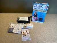 All components including boxed Neck Comforter, Muscle Therapy unit with accessories and manuals