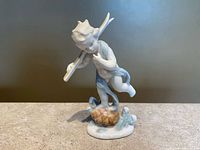 Full view of porcelain cherub figurine