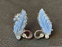 Front view showing opalescent glass leaves, rhinestones and silver-tone setting