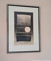 Framed Allen Smutylo print on wall