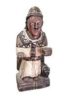 Front view of hand-carved wooden santos statue