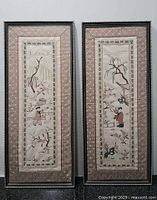 Both framed Chinese embroidered silk panels side by side
