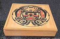 Closed cedar box showing indigenous design on lid