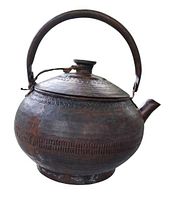 front view of hammered copper teapot showing shape and finish