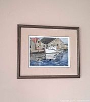 Framed watercolor on wall showing full composition and framing