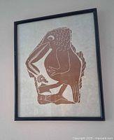 Front view of framed Leah Qumaluk stonecut print