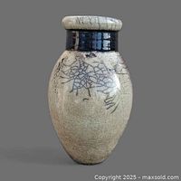 Front view of full vase showing crackle glaze and black collar