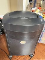 Front view of Royal shredder showing body, wheels, pull-out bin