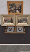Overview of five framed artworks displayed