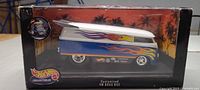 Front view of boxed Hot Wheels Customized VW Drag Bus