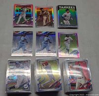 Top view of assorted sleeved cards including four stacks and top-loaded inserts