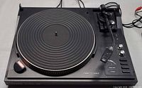 Full view of Telefunken TS 860 turntable showing platter, tonearm, control panel and cords