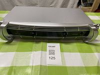 Front view of Behringer NU3000 amplifier on table