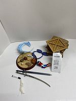 overview of all figurine parts including swords, bases, bow, arm