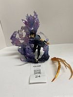 Full view of Sasuke statue with purple Susanoo effect and separate amber part
