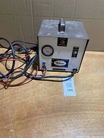 Front view showing gauge, indicator, brand plate and cables