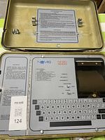 Open Pelican case showing Nomis NCSC 5000 control panel and keyboard