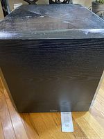 Front view of Paradigm PS-1000 v.3 showing black grille and cabinet