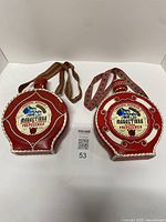 Both red leather-wrapped Mahastirka bottles front view