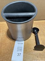 Breville knock box front view with scoop tamper