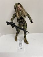 Full view of figure holding rifle
