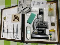 Full kit in open wood case showing microscope and accessories