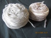Both balls of yarn side by side showing overall size and colours