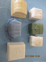 Top view of six plastic jewelry boxes showing shapes and colors