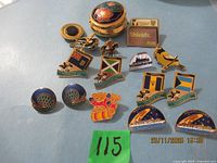 Group shot of pillbox and assorted pins