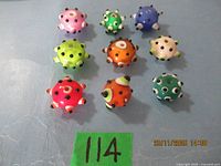 All nine assorted spiked glass beads displayed