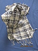 Scarf loosely gathered showing pattern and fringe