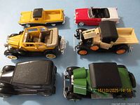 Six die-cast cars arranged for overview