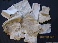 Group shot of all linens piled on dark background