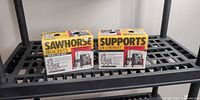 Two boxed Crawford sawhorse brackets on shelf