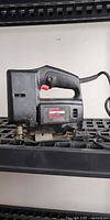Front view of Craftsman sabre saw on shelf