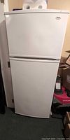 Front view of white Inglis top-freezer refrigerator