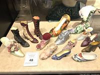 Full view of all miniature shoe figurines on countertop