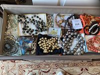 Tray containing full assortment of necklaces, bracelets and earrings